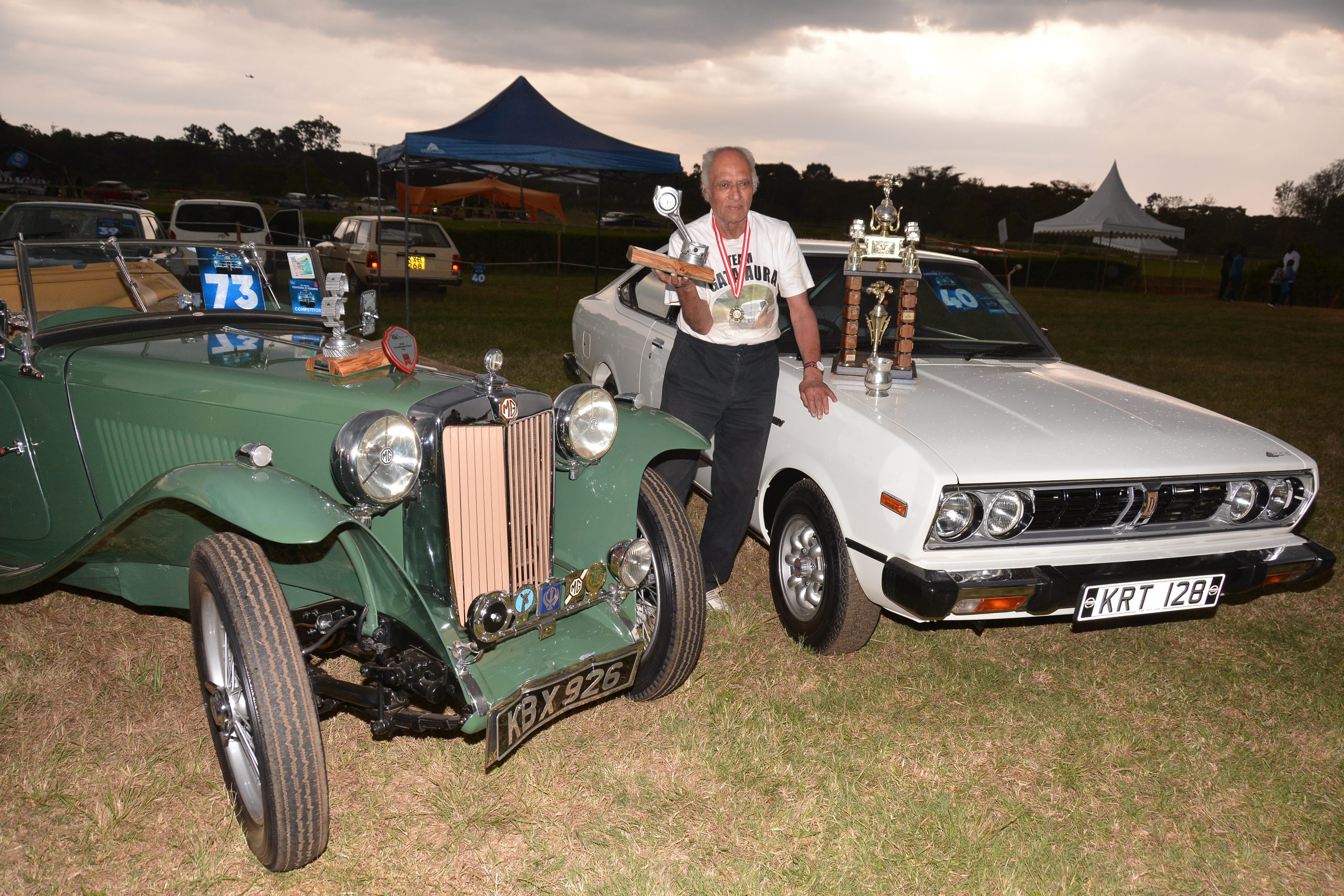 Sati Gata-Aura with his two car that won podium places at this year's Concours d'Elegance. The 1977 Nissan 160J (right) was the overall winner while the 1947 MG TC (left) came second.